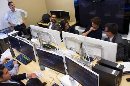 people talk and laugh in computer lab, bird's-eye view