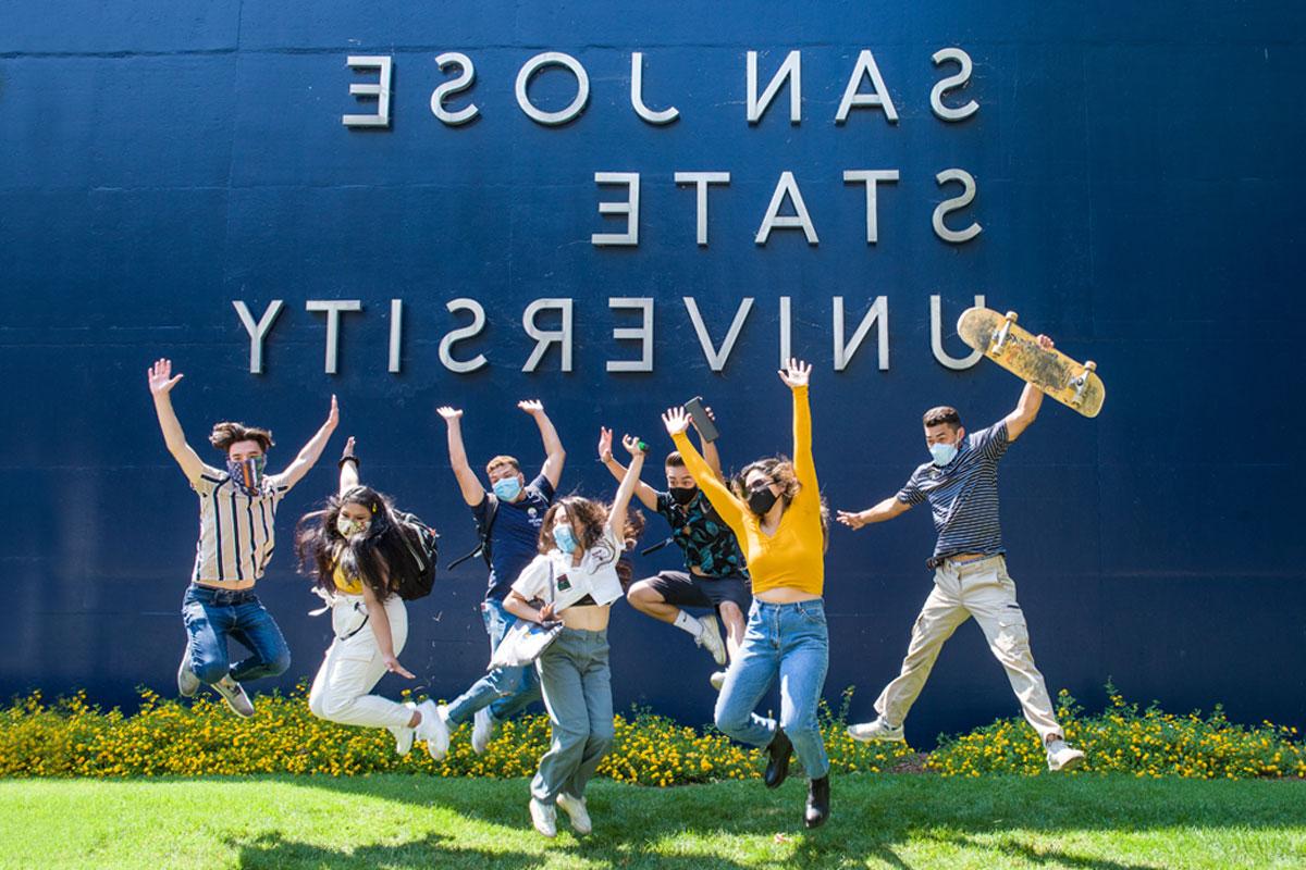 Students jumping in the air.